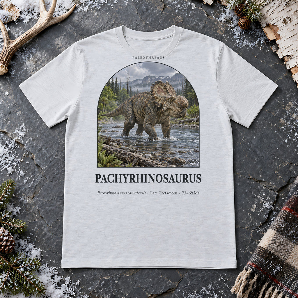 Pachyrhinosaurus t-shirt flat lay – ash PaleoThreads paleo art tee on frosty slate with an antler