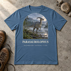 Parasaurolophus t-shirt flat lay – steel blue PaleoThreads paleo art tee with hiking boots and an ammonite