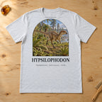 Hypsilophodon t-shirt flat lay – ash PaleoThreads paleo art tee on a fossil prep bench with amber
