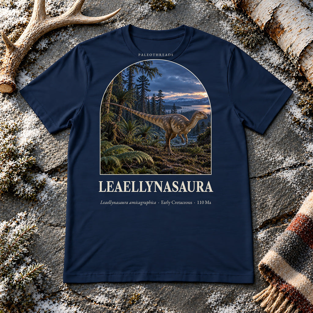 Leaellynasaura t-shirt flat lay – navy PaleoThreads paleo art tee on frosty slate with an antler