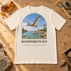 Rhamphorhynchus t-shirt flat lay – natural PaleoThreads paleo art tee on a fossil prep bench with amber