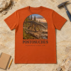 Postosuchus t-shirt flat lay – autumn PaleoThreads paleo art tee on sandstone with a rock hammer