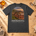 Inostrancevia t-shirt flat lay – dark grey heather PaleoThreads paleo art tee on a fossil prep bench with amber