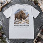 Woolly Rhinoceros t-shirt flat lay – ash PaleoThreads paleo art tee on frosty slate with an antler
