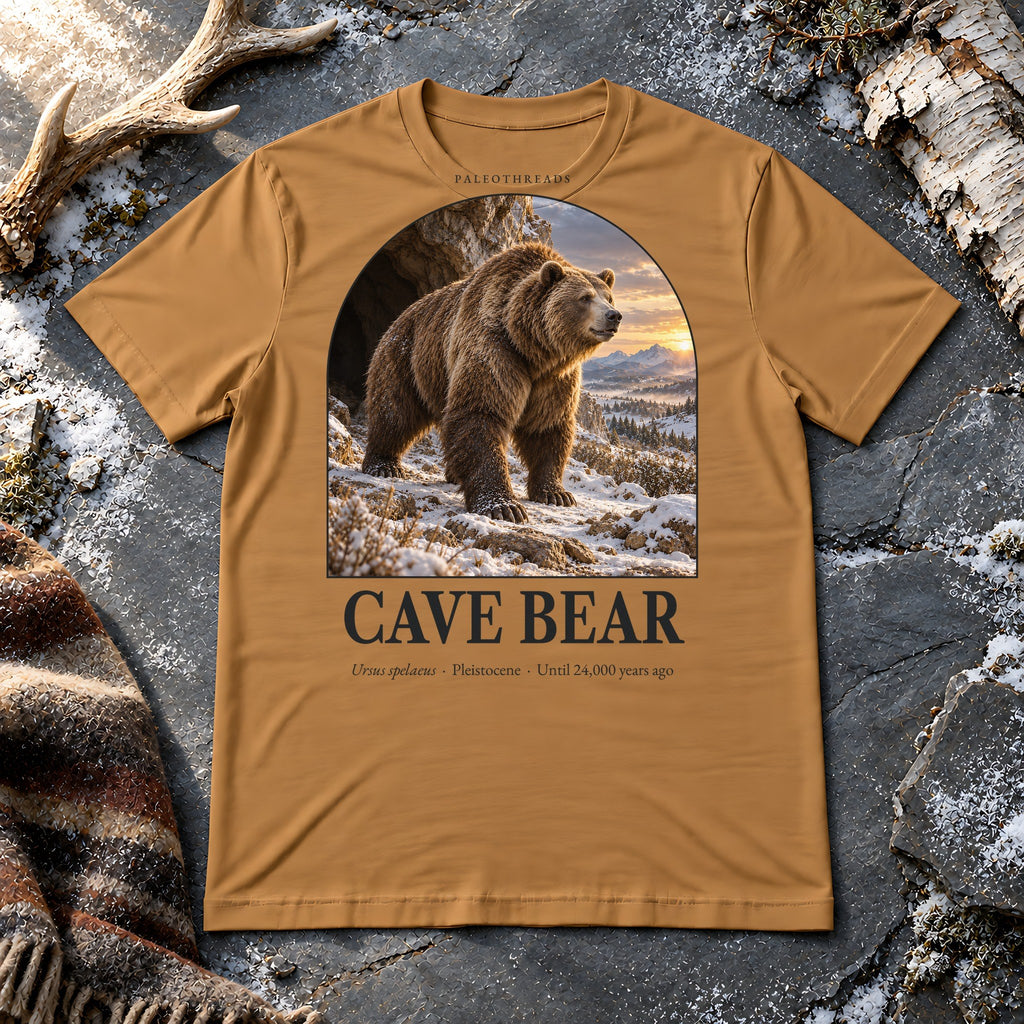 Cave Bear t-shirt flat lay – toast PaleoThreads paleo art tee on frosty slate with an antler